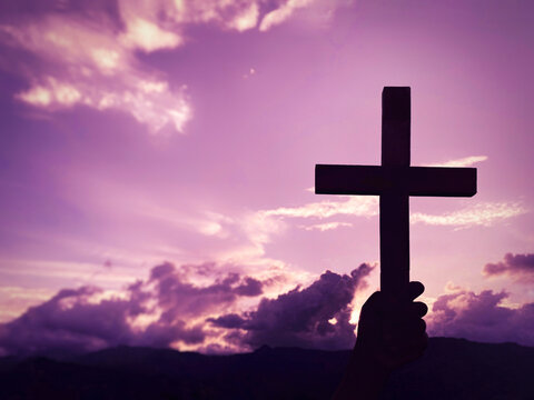 Lent Season,Holy Week and Good Friday concepts - silhouette of cross shape in purple background.