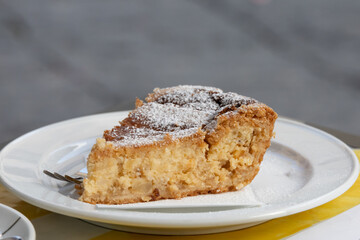 Close up shot from above of a delicious neapolitan cake called PASTIERA NAPOLETANA, made with ricotta cheese, candied peel, orange blossom water and cooked wheat. Delicious treat in Naples.
