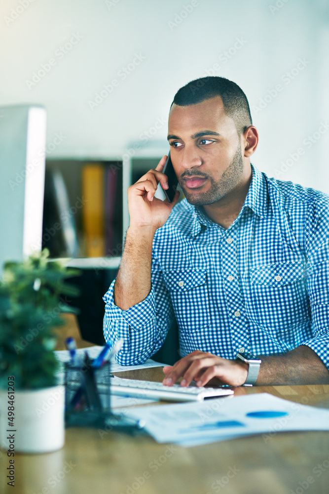 Aufkleber im sending you an email.... shot of a handsome young businessman making a phonecall while working in