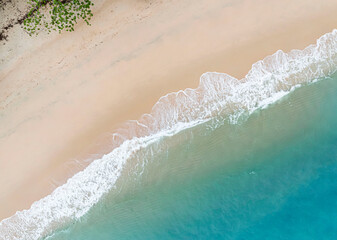 Fototapeta na wymiar Aerial view of Summer tropical background of water wave on the beach,top view image