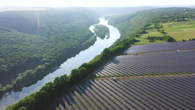 Aerial footage over photovoltaic solar panels. Filmed in UHD 4k video.