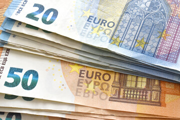 Euro money banknotes background.  20 and 50 Euro notes on the table. 