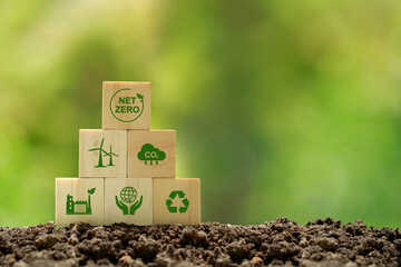 Net zero and carbon neutral concept.wooden cubes with netzero icons - renewable energy, co2...
