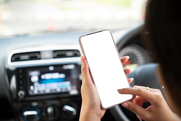 women hands holding phone with isolated screen in the car and is using fingers to touch