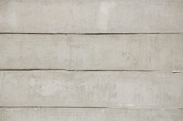 Grey concrete fence outdoors close up.