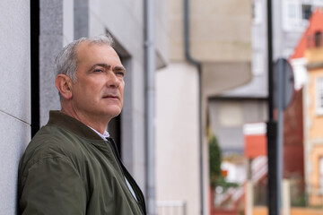 portrait of casual adult man on the street