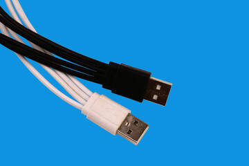 Black and white USB ports. Isolated on a blue background.