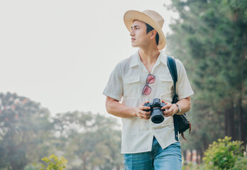 Portrait of young Asian man traveling