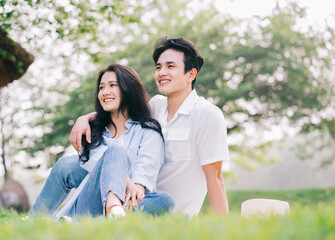 Naklejka premium Portrait of young Asian couple outside