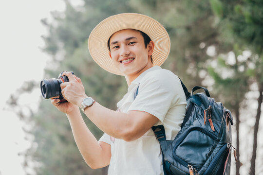 Portrait Of Young Asian Man Traveling