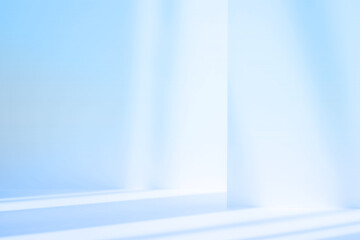 Abstract blue studio background for product presentation. Empty room with shadows of window. Display product with blurred backdrop.