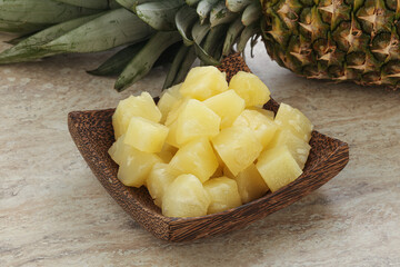 Marinated pineapple slices in the bowl