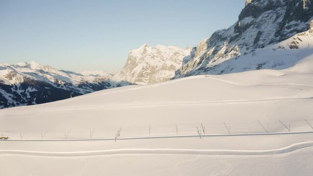 aerial shot over a mountain ridge at Kleine Scheidegg in Switzerland, Grindelwald