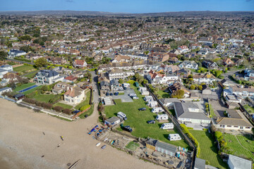 East Preston village Seafront and beach in West Sussex on the south coast of England with the South Downs in the background, Aerial photo.