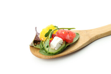 Spoon with salad with orange isolated on white background