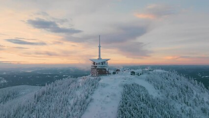 Lysa hora during winter sunrise, Pan up and descending drone, Beskydy UHD