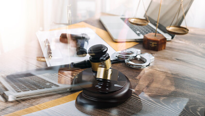 Business and lawyers discussing contract papers with brass scale on desk in office. Law, legal services, advice, justice and law concept picture with film grain effect