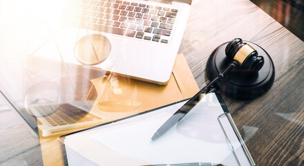 Business and lawyers discussing contract papers with brass scale on desk in office. Law, legal services, advice, justice and law concept picture with film grain effect