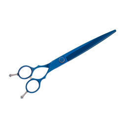 Scissors for cutting people and pets. Grooming scissors. Closed scissors on a white isolated background. Side view.