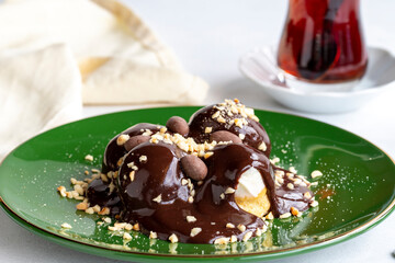 Profiterole on a white background. Profiterole filled with milk cream. Bakery products. close up