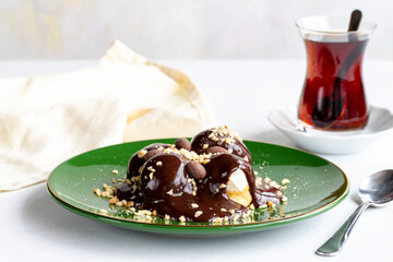 Profiterole on a white background. Profiterole filled with milk cream. Bakery products. close up