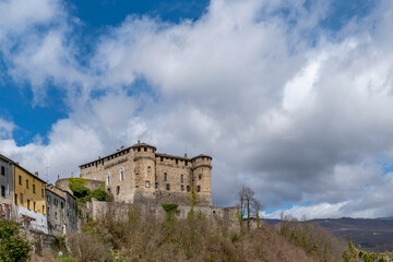 Fototapeta na wymiar The ancient castle of Compiano, Parma, Italy, under a beautiful sky with white clouds