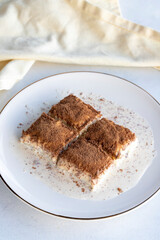 Cold baklava on a white background. Baklava with pistachio milk. Traditional Turkish cuisine delicacies. The new trend is baklava. close-up. local name soguk baklava