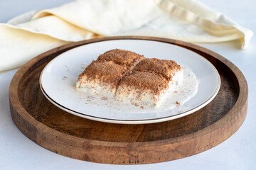 Cold baklava on a white background. Baklava with pistachio milk. Traditional Turkish cuisine...