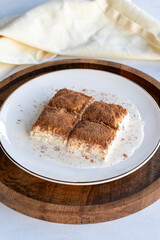 Cold baklava on a white background. Baklava with pistachio milk. Traditional Turkish cuisine delicacies. The new trend is baklava. close-up. local name soguk baklava