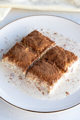 Cold baklava on a white background. Baklava with pistachio milk. Traditional Turkish cuisine delicacies. The new trend is baklava. close-up. local name soguk baklava