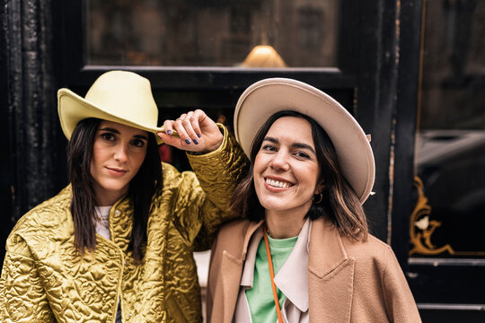 Smiling Women In Stylish Hats