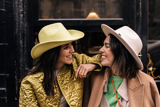 Smiling Women In Stylish Hats