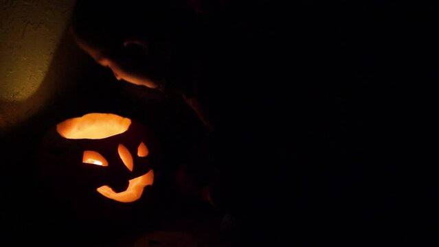 boy and pumpkin burning,Halloween night boy playing with pumpkin