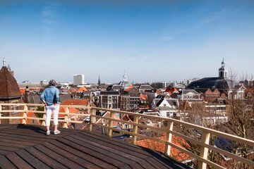 woman looking at the skyline of schiedam