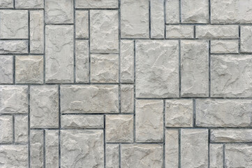 Obraz premium Stone wall texture. Natural sandstone texture cladding background in grey colours .