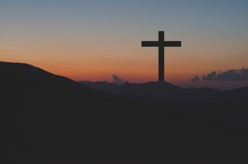 Cross of Jesus. Crucifix against the sky. Easter. Jesus has resurrected.