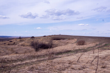 Steppe. Hill against the blue sky. Wasteland.