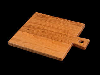Empty brown oak wood cutting board isolated on black