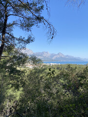 Panoramic view of Kemer, Turkey. View from the height through the pine trees of the Mediterranean coast. Chalysh mountain in Kemer, Turkey