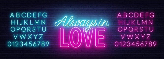 Always in love neon lettering on brick wall background .