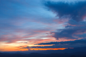Colorful Cloudy sky At Sunset Dawn Sunrise. Sun Over Skyline,