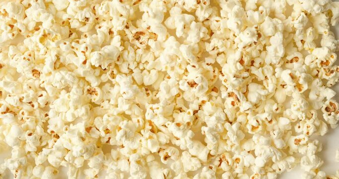 Background with popcorn. Looped 4K stop motion animation