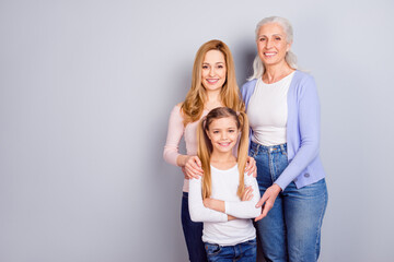 Portrait of three idyllic positive woman cuddle toothy smile look camera isolated on grey color...