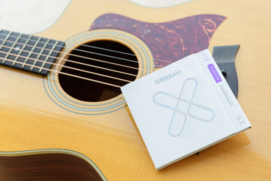Bangkok , Thailand -  16 Jan, 2022 : Closeup to D'Addario XS series acoustic strings pakage on the acoustic guitar