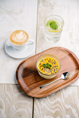 panna cotta with mango and passion fruit sauce