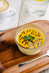 panna cotta with mango and passion fruit sauce