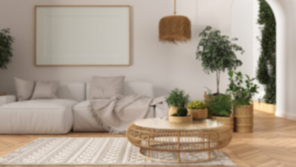 Blur background, scandinavian wooden living room with parquet and carpet, frame mockup, sofa, pillows, round rattan table, potted plants, pillows and decors. Modern interior design