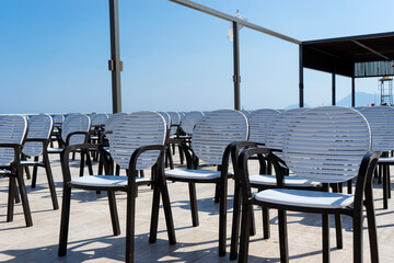 Rows of chairs standing in the open air, concert area