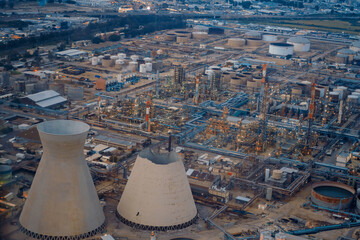 Large industrial Refinery chimneys. Aerial Panoramic view from privat aircraft of upper part of eastern inactive cooling tower, Haifa. Oil Refineries had collapsed on June 12th, 2020. on conservation