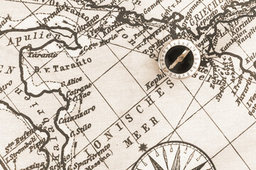 Magnetic old compass on world vintage  map.Travel, geography, navigation, tourism and exploration...